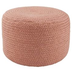 a large round poufle with braiding on the top and bottom, in pink