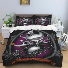 a bed with a black and purple comforter