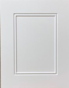 a white square frame on the wall