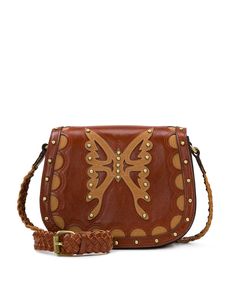 The graceful curves and petite silhouette of the handcrafted Salerno Saddle Bag is the definition of country-chic. This bag is gorgeous in the distinctive Western Lux design. 100% full-grain leather Interior: 1 zip pocket, 2 slip pockets; faux suede lining, 100% polyester Exterior: 1 front slip pocket, 1 rear slip pocket, burned edge finish Magnetic snap closure Signature brushed brass hardware, heavy handcrafted stitching Dimensions: 9 1/4"(W) x 7 1/2"(H) x 4"(D) Strap drop: 22" - 24" Leather Handle Saddle Satchel, Brown Leather Trim Crossbody Saddle Bag, Brown Saddle Bag With Removable Pouch For Fall, Leather Backed Saddle Shoulder Bag, Fall Leather Saddle Bag With Detachable Strap, Leather Saddle Bag With Detachable Strap For Fall, Brown Leather Trim Saddle Shoulder Bag, Brown Leather-lined Saddle Bag, Chic Brown Saddle Bag With Leather Handles