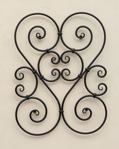 wrought iron heart wall decoration on a white wall