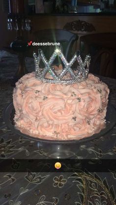 a cake with pink frosting and a tiara on top is shown in an instagram