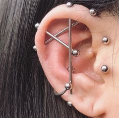 an ear piercing with several balls attached to it