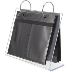 a clear and black folder with two rings on the front, hanging from an acrylic holder