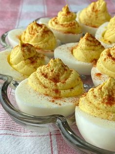 deviled eggs with cinnamon sprinkles in a glass dish