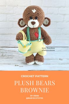 a crochet teddy bear holding a purse