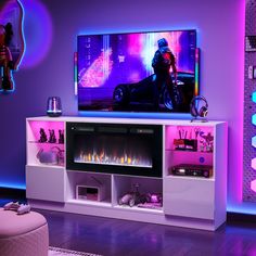 a living room with purple lighting and a flat screen tv on top of a white entertainment center