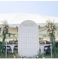 an outdoor seating area is set up with tables and chairs for the guests to sit at