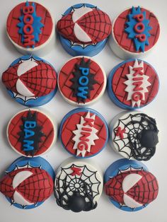 twelve spiderman cupcakes decorated with fondant icing