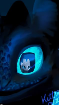 a close up of a dragon's eye with blue light coming from the inside