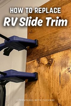 the rv slide trim is attached to a wooden wall with two blue handles on it