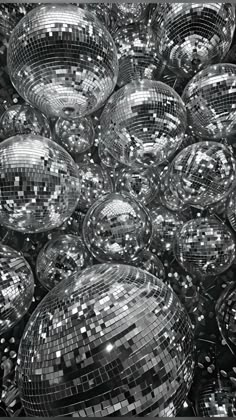 black and white photograph of shiny disco balls