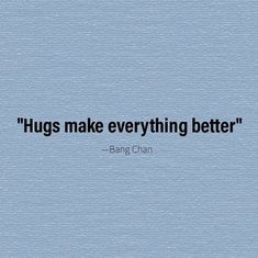 a blue wall with a quote on it that says, hugs make everything better bang chan