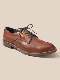 A versatile oxford shoe with sleek, minimalist design, made in luxe, Italian leather.  Designed with lightweight, durable OrthoLite® performance insoles for breathable cushioning that wicks away moisture for the ultimate in comfort.  Our Advanced Co Slip-on Oxfords For Derby, Business Slip-on Oxfords With Ortholite Insole, Classic Lace-up Shoes With Ortholite Insole, Slip-resistant Leather Dress Shoes With Round Toe, Formal Low-top Dress Shoes With Ortholite Insole, Formal Dress Shoes With Ortholite Insole, Classic Low-top Lace-up Shoes With Cushioned Footbed, Business Low-top Oxfords With Ortholite Insole, Classic Brown Oxfords With Ortholite Insole