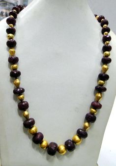 "Natural faceted Ruby & 22 K gold beads necklace strand with adjustable cord. Length end to end (Ruby only)-56 cm( 22.05\")free size easy to adjust the length by adjusting toggle. Size of center Ruby bead-15/13 MM, weight -165 grams, material-Natural Rubies and 22 K gold beads with wax inside." Gold Gemstone Beads Long Necklace, Gold Faceted Long Beaded Necklace, Gold Temple Necklace With Gemstone Beads For Festivals, Traditional Gold Single Strand Beads, Traditional Single Strand Gold Beads, Gold Faceted Beads For Temple Jewelry, Gold Beaded Necklaces With Faceted Round Beads, Gold Temple Jewelry Necklace With Faceted Beads, Gold Adjustable Necklace With Oval Beads