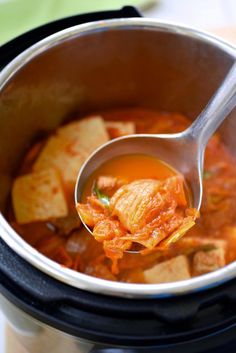 a spoon full of soup in an instant pot