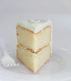 a piece of cake sitting on top of a white plate with a fork next to it