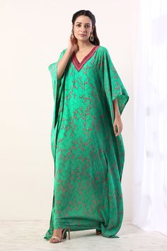 Green kaftan with all-over floral-geometric print, embroidered neckline and asymmetric hem. Comes with inner slip.
Component: 2
Printed, Embroidered
Neckline: V-Neck
Sleeve Length: Three Quarter
Fabric: Crepe
Color: Green - Aza Fashions Green Kaftan, Kaftan Set, Kaftan For Women, Embroidered Kaftan, Green Hand, Bridesmaid Outfit, Embroidered Neckline, Indian Fashion Designers, Pernia Pop Up Shop