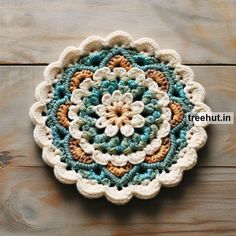 a crocheted doily is sitting on a wooden surface with the words freehut in it