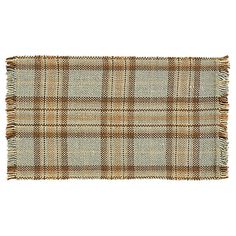 a brown and white plaid rug on a white background