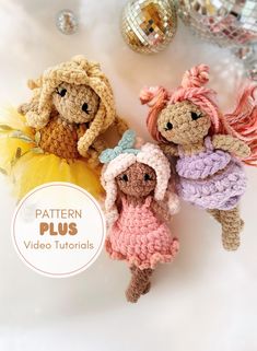 three crocheted dolls sitting next to each other on top of a white surface