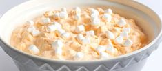 a bowl filled with marshmallows on top of a table