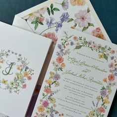 three wedding cards with floral designs on them