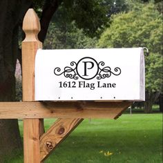 a mailbox sitting on top of a wooden post