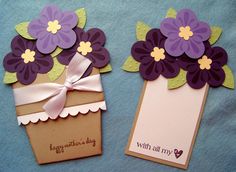 two cards with purple flowers on them are sitting next to each other and one has a tag that says happy mother's day