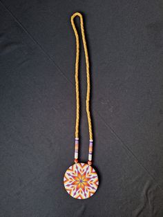 Beaded star quill medallion with a leather four braid chain. Adjustable Medallion Beaded Necklaces For Festivals, Adjustable Amulet Style Medallion Necklace, Handmade Adjustable Medallion Necklace, Adjustable Medallion Necklace With Large Pendant, Four Braid, Beaded Star, Dangle Charms, Service Provider, New Product