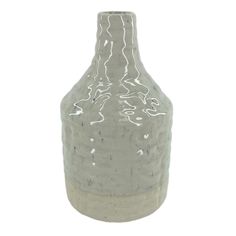 a gray vase with white speckles on the top and bottom, sitting in front of a white background