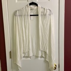 Cream Sheer Cardigan White Wrap Cardigan For Fall, Chic One Size Open Front Top, One Size Spring Wrap Cardigan, White Long Sleeve Shrug For Spring, White Shrug For Spring Layering, Casual White Open Front Sweater, Chic One-size Spring Cardigan, Spring Wrap Shrug, White Spring Cardigan For Layering