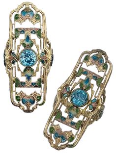 Plique-à-jour enamel, a 1.75 ct. zircon, and 14k gold. 1 7/8 inches (45mm) long by 3/4 inch (20mm) wide. Art Deco Enamel Ring Jewelry, Art Deco Enamel Jewelry Ring, Art Deco Enamel Jewelry For Anniversary, Antique Enamel Rings For Formal Occasions, Antique Oval Enamel Ring Collectible, Antique Enamel Ring Jewelry, Art Deco Hallmarked Enamel Jewelry, Art Deco Multi-stone Collectible Jewelry, Art Deco Enamel Anniversary Ring