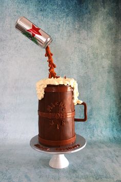 a chocolate cake with whipped cream being poured into it and topped with a flag on top