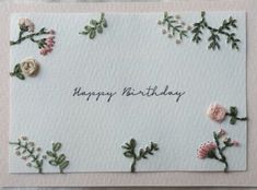 a birthday card with flowers on it and the words happy birthday written in black ink