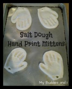 four handprint mittens on a baking sheet that says salt dough hand print mittens