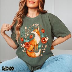 This Fox Cottagecore Sweatshirt is a cozy top perfect for nature lovers. The whimsical design of a folk art floral fox is ideal for those who enjoy the fall forestcore vibe. It's a great gift for folklore enthusiasts and those who appreciate wildflowers. This sweatshirt is relevant for autumn celebrations and casual wear. 📝PLEASE CONFIRM📝 This is a standard unisex size Comfort Colors Tee. For an oversized tee, please size up. If you are looking for an oversized "T-shirt Dress" look, we recomme Cozy Cotton Top With Graphic Print, Cute Printed Tops For Fall, Cozy Graphic Print Tops For Spring, Cottagecore Relaxed Fit Crew Neck Tops, Cottagecore Relaxed Fit Top For Fall, Relaxed Fit Cottagecore Crew Neck Top, Cottagecore Graphic Print Top With Relaxed Fit, Cottagecore Relaxed Fit Top With Graphic Print, Cottagecore Crew Neck Graphic Print Top