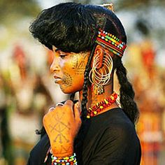 a woman with tattoos on her face and head