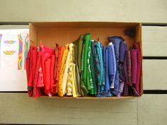 an open box filled with different colored umbrellas