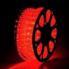 red led strip lights on a dark surface with the light turned on and glowing from behind