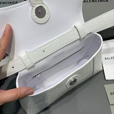 SHOP MORE LUXURY PRODUCTS HERE Description Balenciaga Downtown XS Shoulder Bag In White, For Women, Women’s Bags 10in/25cm Size:ÃƒÂ¯Ã‚Â¿Ã‚Â½ÃƒÂ¯Ã‚Â¿Ã‚Â½ÃƒÂ¯Ã‚Â¿Ã‚Â½ÃƒÂ¯Ã‚Â¿Ã‚Â½ 25 x 16 x 8.3 cm / 10 x 6.3 x 3.3 inches (Lenght x Height x Width) Curvilinear baseAdjustable and removable shoulder strapSliver hardwareMagnet closureB logo hardware1 back pocket1 inner zipped pocketWipe with a soft cloth Includes box, dust bag.This product is of the premium quality. Designer Crossbody Baguette Bag, Designer White Baguette Bag For Shopping, Designer White Top Handle Baguette Bag, Designer White Baguette Bag With Top Handle, White Baguette Crossbody Bag For Shopping, White Crossbody Baguette Bag For Shopping, Baguette Pouch Bag With Top Carry Handle For Shopping, Pouch-shaped Baguette Bag With Top Handle For Shopping, White Baguette Bag With Top Handle