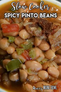 slow cooker spicy pinto beans recipe in a white bowl with text overlay that reads slow cooker spicy pinto beans