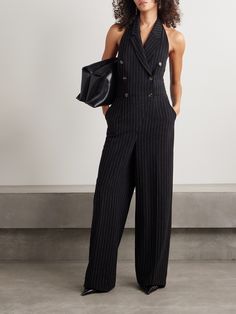 Sergio Hudson's tailored jumpsuit is sophisticated and chic. Made from pinstriped twill, it has a double-breasted profile with notch lapels and a halter neckline and floor-grazing hems. Chic Pinstripe Suits For Business, Chic Pinstripe Business Suits, Chic Pinstripe Suits For Office, Chic Striped Suits For Office, Chic Striped Business Suits, Chic Fitted Jumpsuits And Rompers With Vertical Stripes, Chic Striped Jumpsuits And Rompers For Work, Sergio Hudson, Tailored Jumpsuit