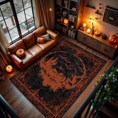 a living room filled with furniture and a large rug on top of a wooden floor