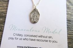 "Beautifully packaged and perfect for gift giving! Miraculous Medal Necklace vintage replica Catholic pendant Sterling Silver or 18k Gold Vermeil Matt finish MED-01-NECK Sterling Silver Medal 18\" Sterling Silver Satellite chain with spring clasp Gold plated Sterling (Vermeil) MATT finish Medal 18\" Gold plate Satellite chain with spring clasp Pendant size: 20mm length (including hoop) x 11mm wide Gold vermeil is 18k gold plate over sterling silver The Medal of the Immaculate Conception, popular Daughters Of Charity, Miraculous Medal Necklace, Silver Cross Bracelet, Immaculate Conception, Miraculous Medal, Cross Bracelet, Mother Mary, Necklace Vintage, Sterling Silver Charm