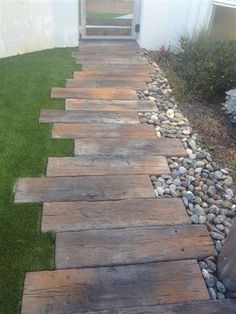 a walkway made out of wood and stones