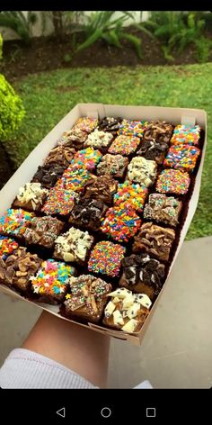 a box filled with lots of different types of cookies