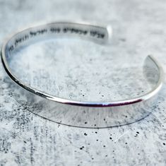 Say a prayer for Israel every day with this beautiful hand crafted minimalist cuff bracelet. On one outside edge is a simple Magen David and most of the first line of Avinu Shebashmayim is on the inside.אָבִינוּ שֶׁבַּשָּׁמַיִם צוּר יִשְׂרָאֵל וְגוֹאֲלוֹ בָּרֵךְ אֶת מְדִינַת יִשְׂרָאֵלThe phrase will be stamped starting from the edges as shown. If you want this stamped in a different configuration, please message me for a custom order. Each bracelet is handmade to order for you and each one is a Mens Silver Cuff Bracelet, Mens Cuff Bracelets, Say A Prayer, Sterling Bracelets, A Prayer, Silver Cuff Bracelet, Silver Cuff, Silver Man, Beautiful Hand