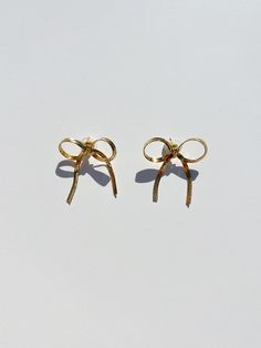 Gorgeous Gold Bow Earrings! Shine like the sun every day with these dainty and delightful earrings. 🌞 🎀 Details Gold plated metal bow stud earrings.1.5" in length, 1.5" in widthNickel freeMade in Rhode Island Bow Earrings Gold, Gold Bow Earrings, Bow Things, Bows Earrings, Senior Fashion, White Coat Ceremony, Metal Bow, Eclectic Aesthetic, Lisa Says Gah