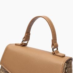 Elevate your summer wardrobe with this must-have dual straw and vegan leather crossbody. Its chic silhouette and structured composition make it perfect for both work and play 100% Vegan Leather 8''W x 6''H x 3 1/2''D 23" Strap 4" Top Handle Magnetic Snap Closure 1 inner zipper pocket 13.33 oz Style# X4CL05 Easter Sale, A Night To Remember, Summer Wardrobe, Leather Crossbody, Snap Closure, Top Handle, Everyday Essentials Products, Sunnies, Zipper Pocket